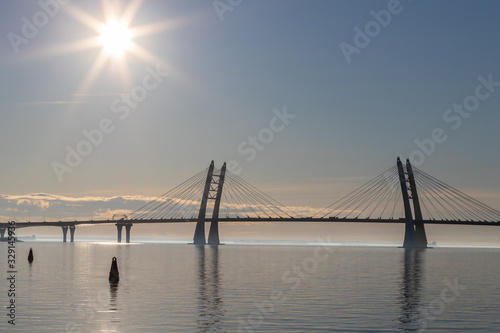 View from Vasilievsky island of St. Petersburg on the high- speed bridge over the Neva river. Sunset on the river and Bay.