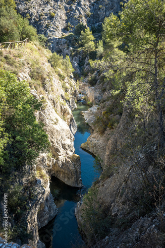 Small Mediterranean river, channeled between rocks