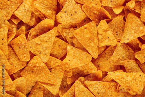 Heap of Mexican nachos or tortilla chips as texture background photo