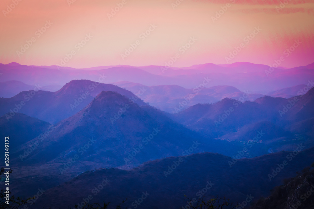 colorful mountains with orange sky landscape