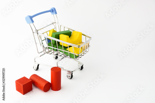 Coloring wooden toys with small shopping trolley or online chart on the white background 