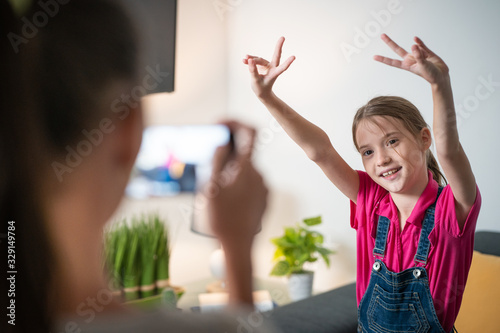 Girl Filming With Smartphone Camera Her Little Sister Dancing