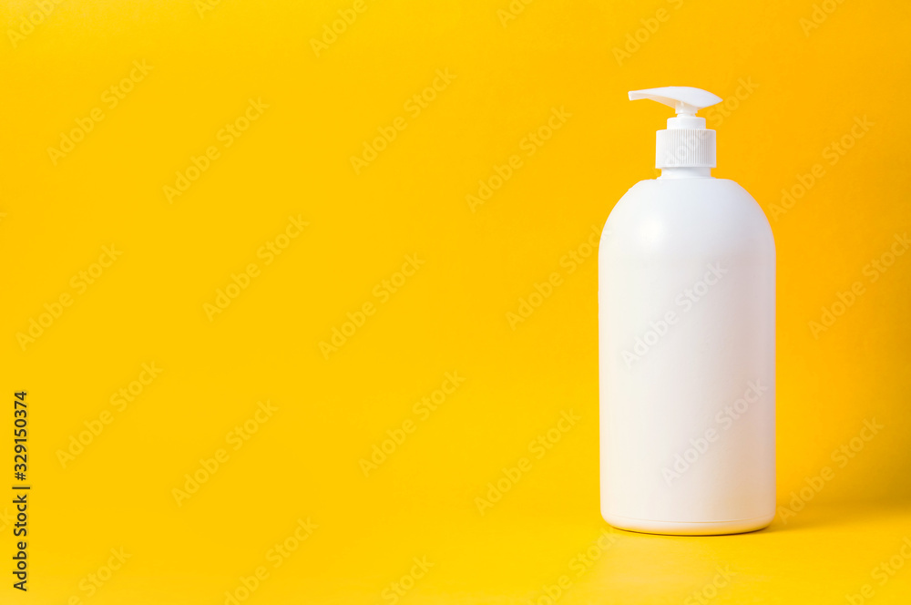 White bottle for cleaner or liquid soap on yellow background. Mock up for text or design White bottle for cleaner or liquid soap on yellow background. Mock up for text or design