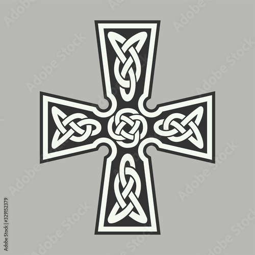 Celtic ornament in the form of a cross. Isolated vector.