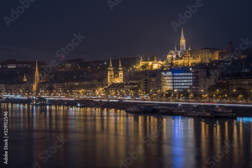 Danube river and illuminated historic boildings at night in Budapest, Hungary