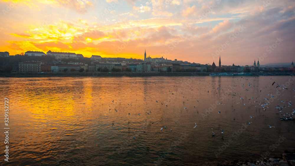 Danube river and historic buildings at sunset in Budapest, Hungary