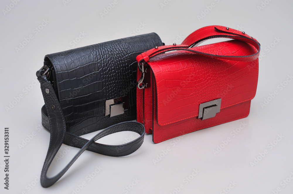 Naklejka premium Women's leather bag on a gray background