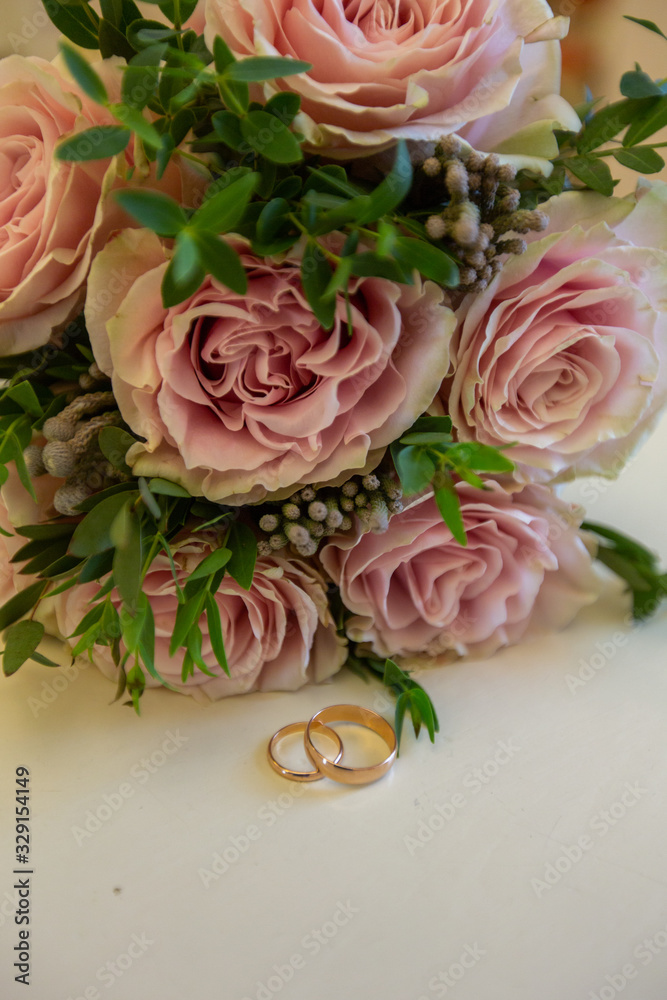 Wedding rings with wedding bouquet