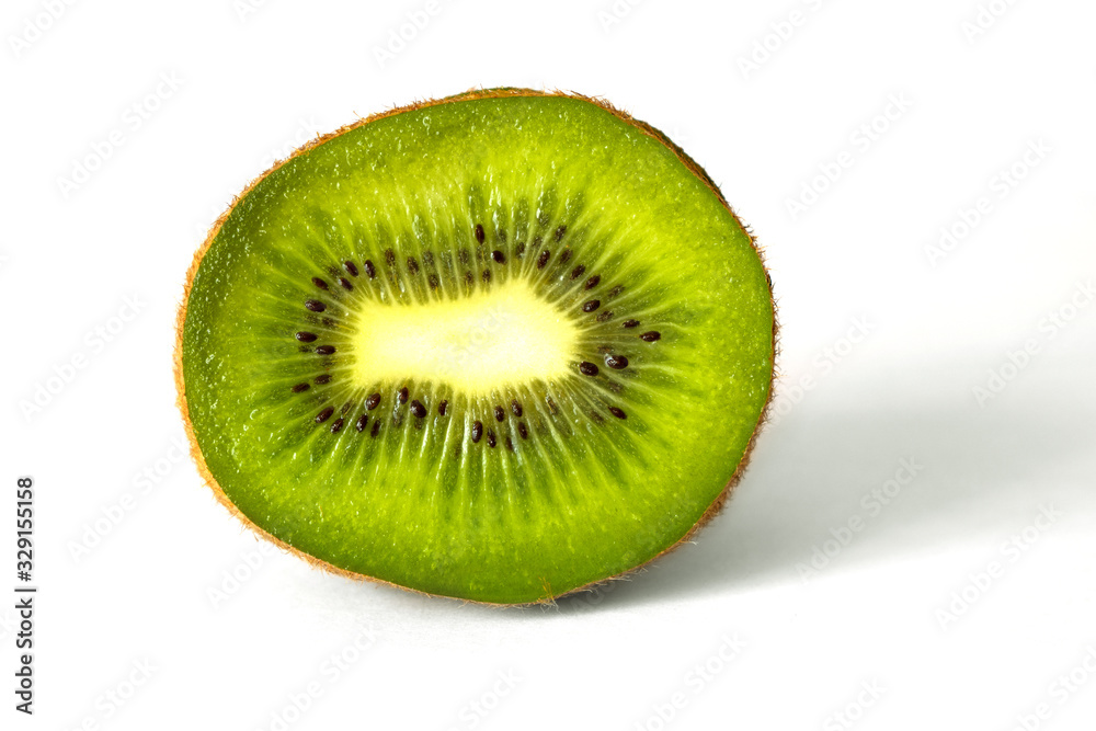 Slice of kiwi close up on white isolated background_ Slice of kiwi close up on white isolated background_