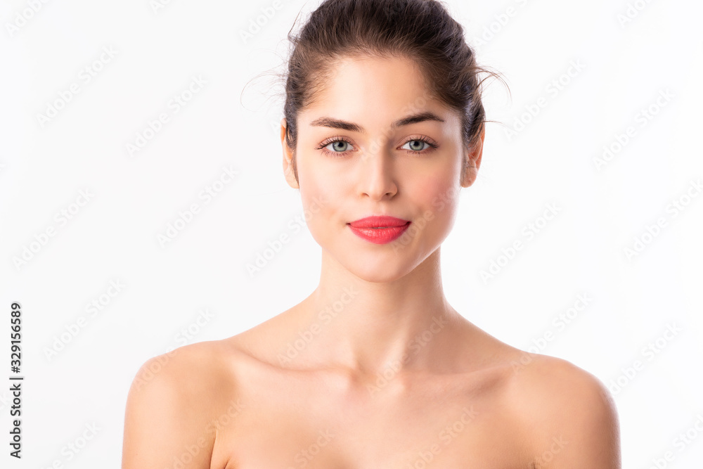 Beautiful young woman wearing red lipstick while posing at isolated white background Beautiful young woman wearing red lipstick while posing at isolated white background