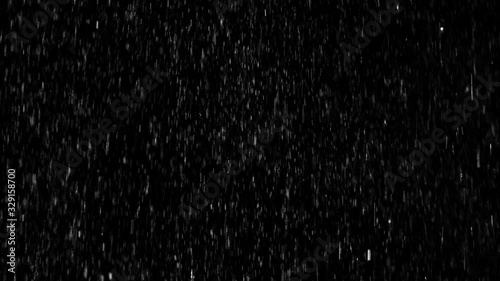 Medium heavy droplets of rain, falling on an isolated background 