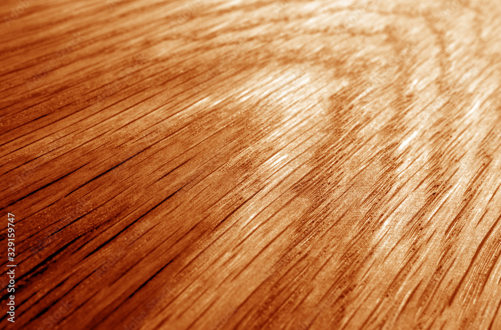 Naklejka premium Wooden board texture with blur effect in orange tone.
