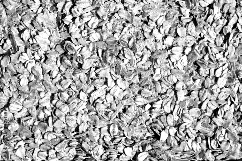 Pile of oatmeal close-up in black and white. Pile of oatmeal close-up in black and white.