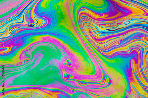 Psychedelic abstract background. Photo macro shot with light interference on the surface of a soap bubble