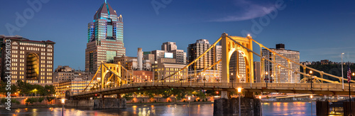 City panoramic skyline view over the Allegheny River and Roberto Clemente Bridge in downtown Pittsburgh Pennsylvania USA