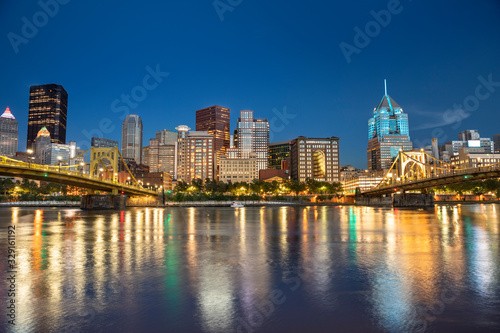 City skyline view over the Allegheny River and Roberto Clemente Bridge in downtown Pittsburgh Pennsylvania USA