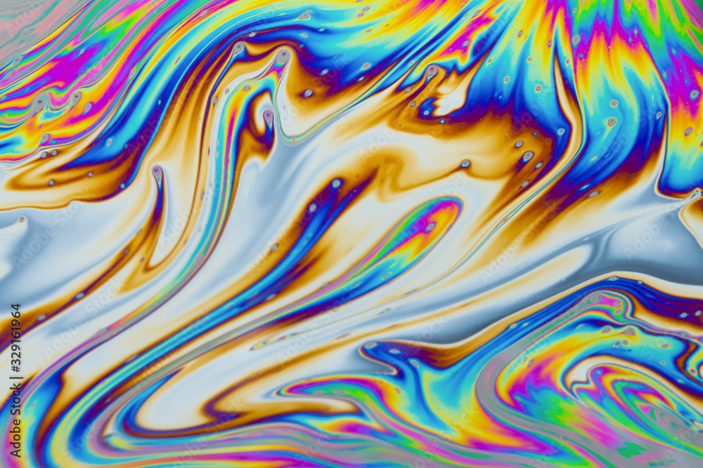 Psychedelic multicolored patterns background. Photo macro shot of soap bubbles