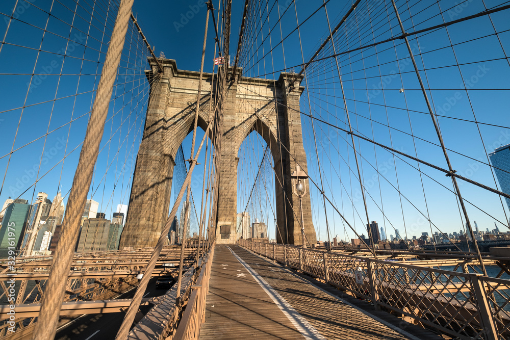 Fototapeta premium Pedestrian path over the Brooklyn Bridge connecting Manhattan New York City over the East River