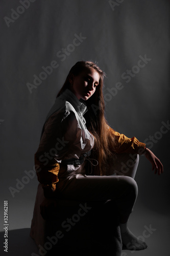 Teen girl in stylish clothes. Trend photos in 90s style. Toning photos with highlights.