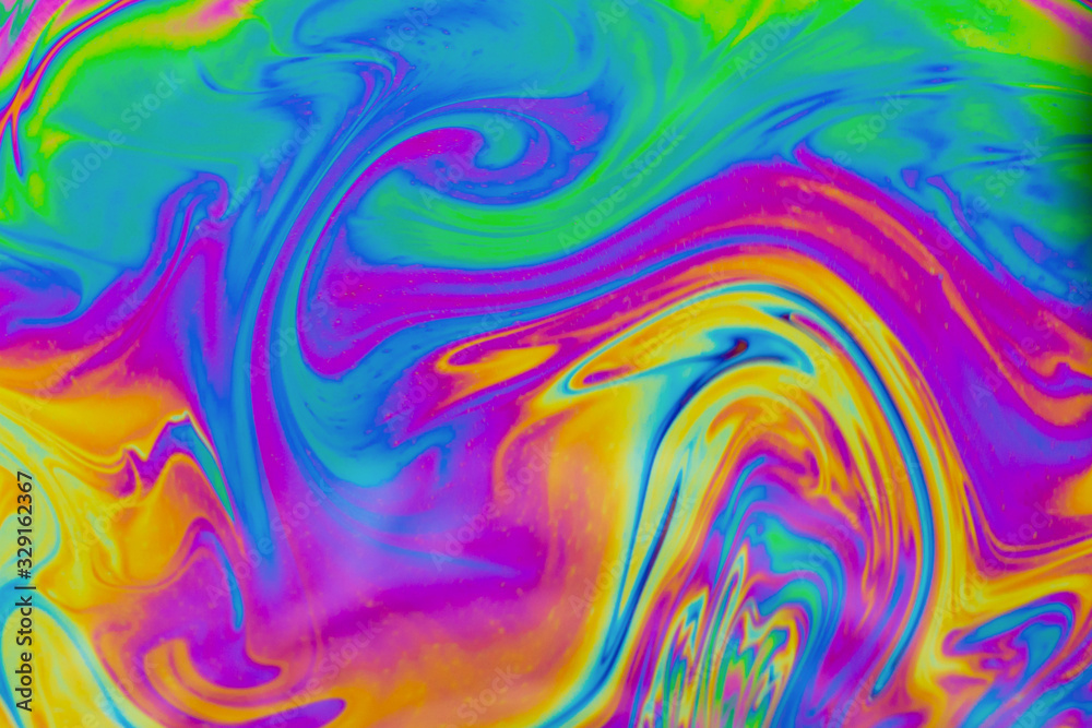 Psychedelic abstract background. Photo macro shot with light interference on the surface of a soap bubble