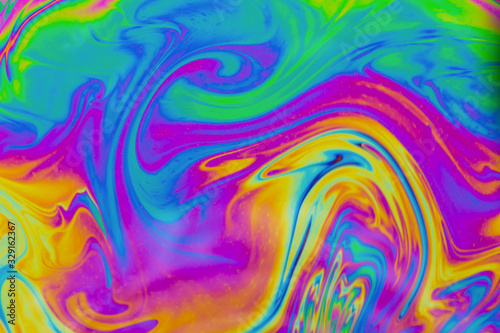 Psychedelic abstract background. Photo macro shot with light interference on the surface of a soap bubble