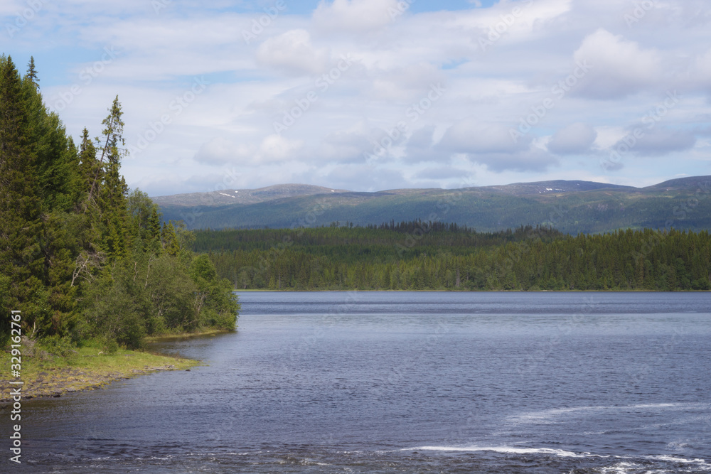 View of the hills and Våmviken lake near the waterfall