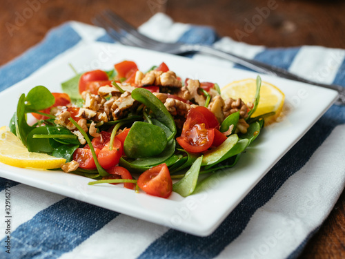 Winter purslane salad with tomatoes and toasted walnuts