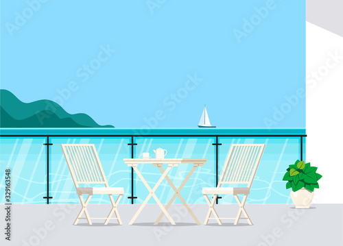 Balcony with sea view with a cozy corner with garden furniture.