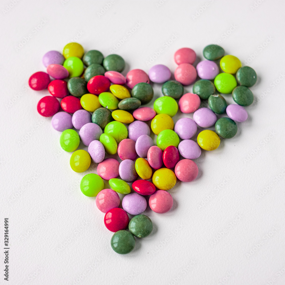 colorful medication and candies on white background colorful medication and candies on white background