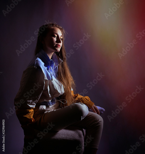 Teen girl in stylish clothes. Trend photos in 90s style. Toning photos with highlights.