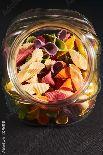 colorful glass jar full of conchigliette paste photo