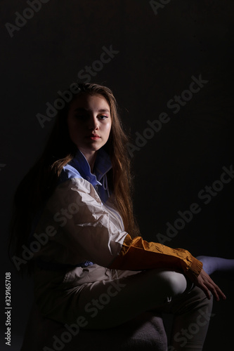 Teen girl in stylish clothes. Trend photos in 90s style. Toning photos with highlights.