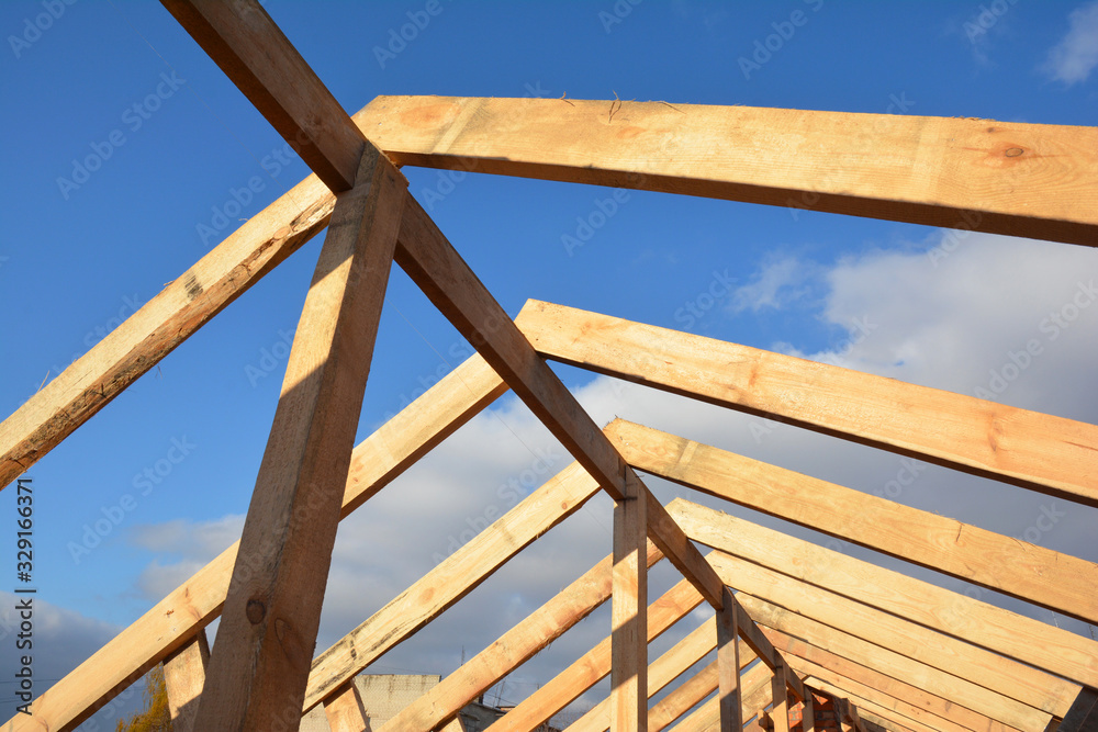 Wooden roof frame house construction.  House rooftop wooden frame construction.