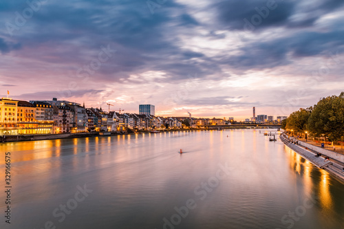 Basel, Switzerland. View over Rhine river at Basel city during amazing sunset. Amazing seasonal autumnal scenery. © Feel good studio