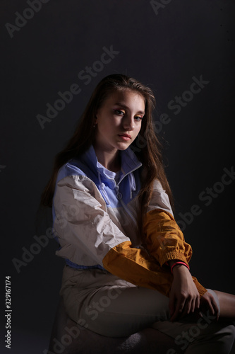 Teen girl in stylish clothes. Trend photos in 90s style. Toning photos with highlights.