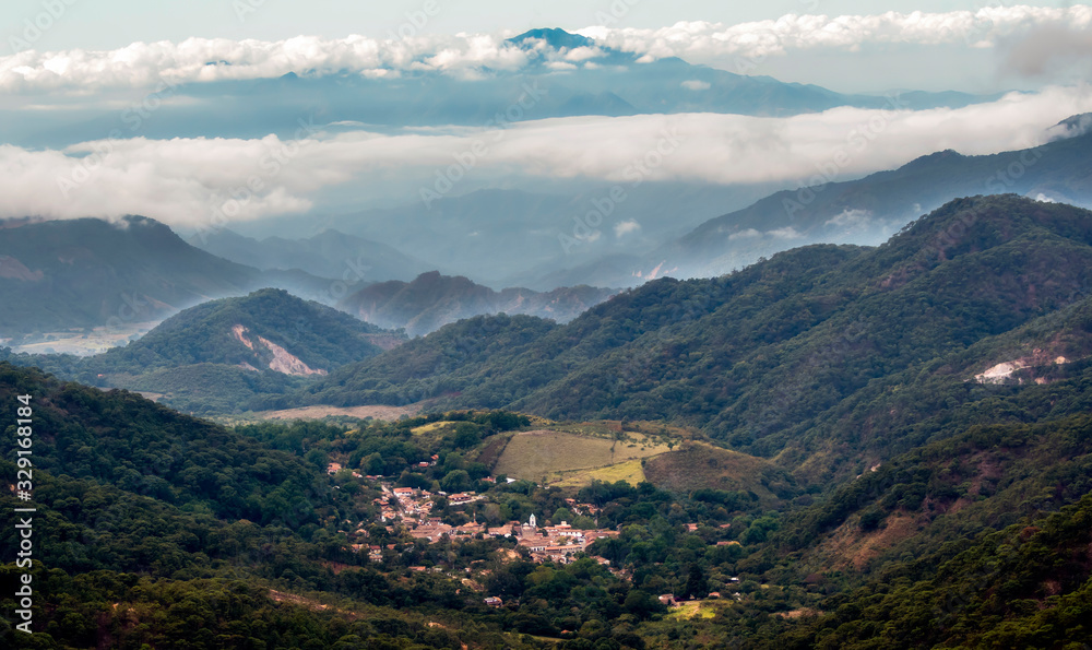 Looking at the Mexican Town of El Tuito from La Bufa in a Forested Landscape, Jalisco, Mexico