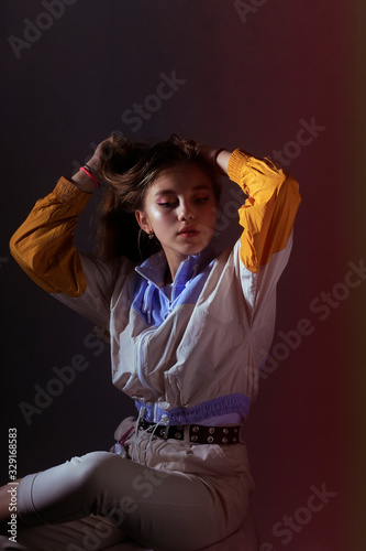 Teen girl in stylish clothes. Trend photos in 90s style. Toning photos with highlights.