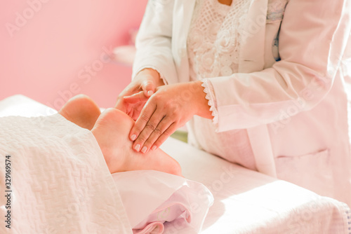 Foot massage therapy  with specialized professional