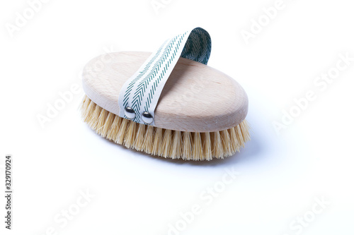 Natural wooden brush on a white background