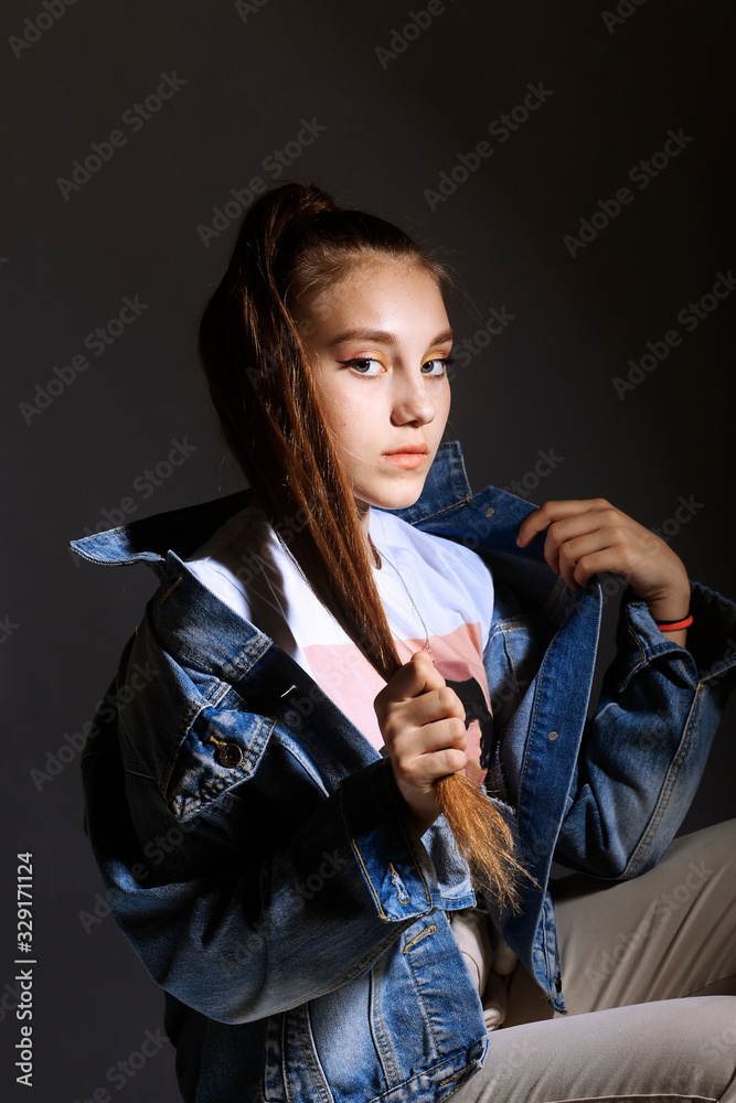 Teen girl in stylish clothes. Trend photos in 90s style. Toning photos with highlights. Teen girl in stylish clothes. Trend photos in 90s style. Toning photos with highlights.