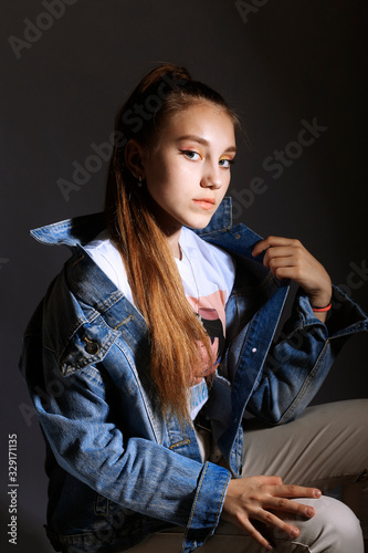 Teen girl in stylish clothes. Trend photos in 90s style. Toning photos with highlights.
