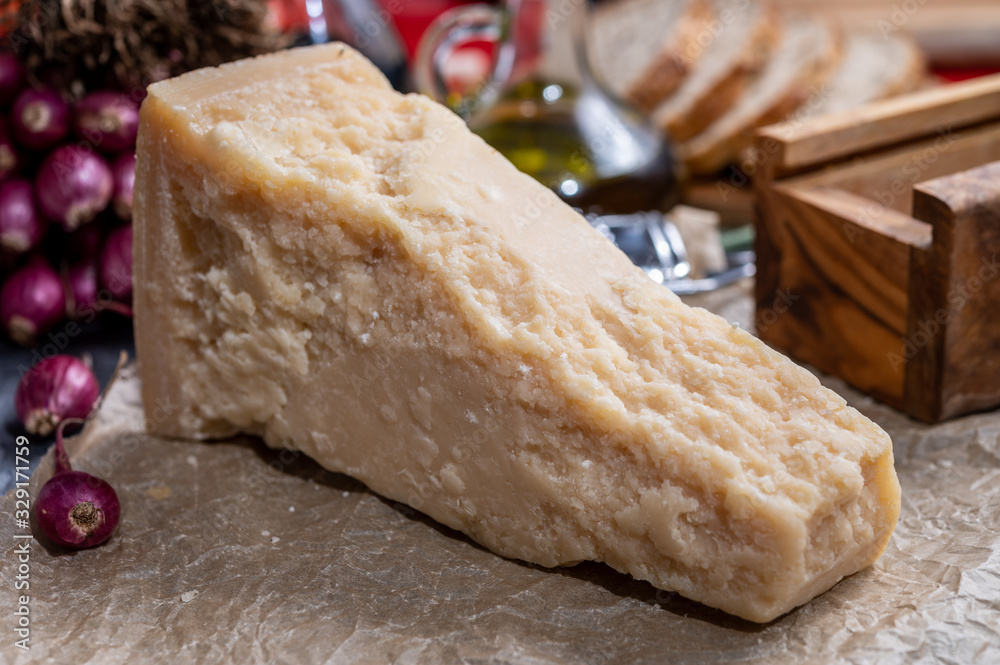 One piece of authentic Parmigiano-Reggiano or Parmesan Italian hard, granular cheese One piece of authentic Parmigiano-Reggiano or Parmesan Italian hard, granular cheese