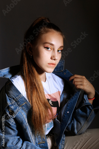 Teen girl in stylish clothes. Trend photos in 90s style. Toning photos with highlights.