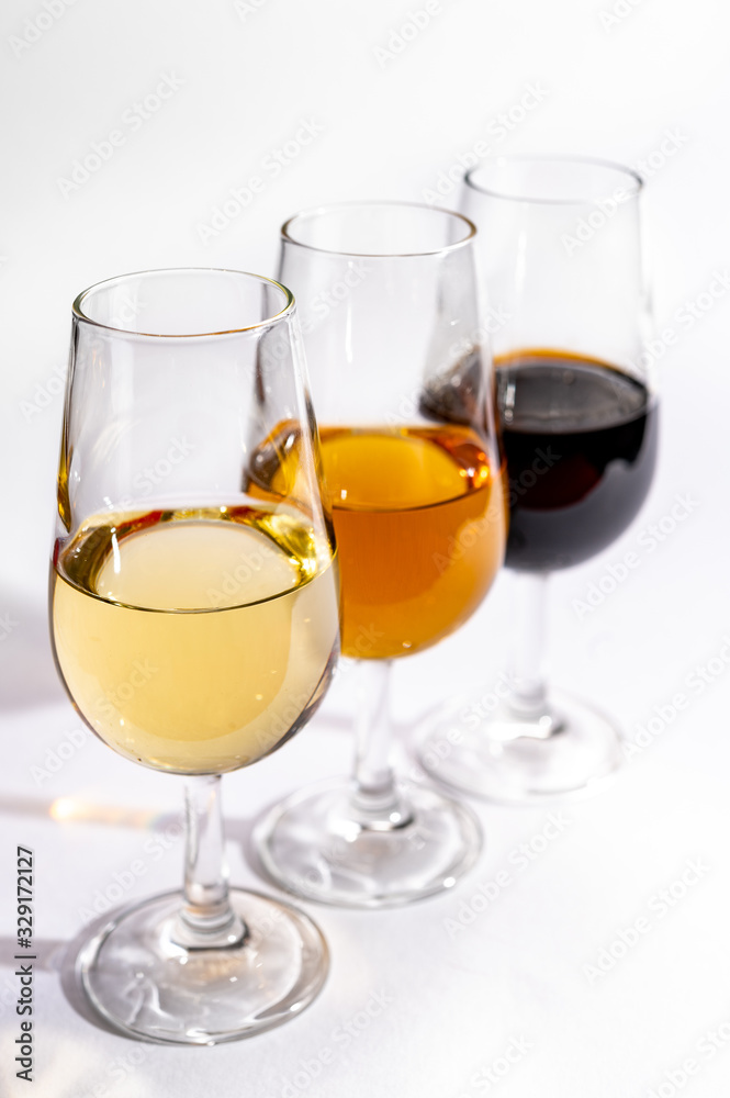 Fortified wine from Andalusia, Spain, different types of sherry in glasses on white background