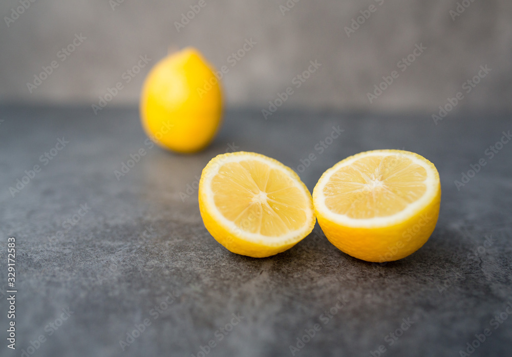 yellow lemon cutaway on a gray background yellow lemon cutaway on a gray background