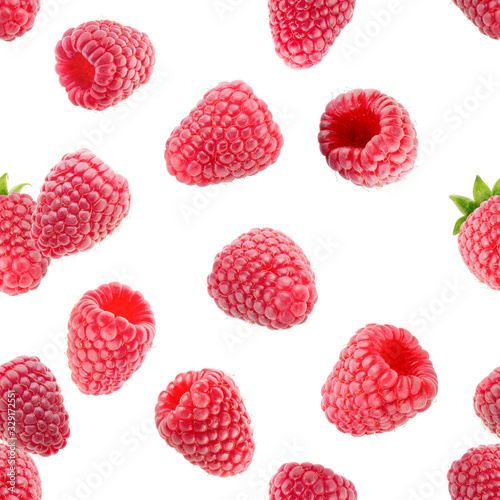 falling raspberries isolated on a white background
