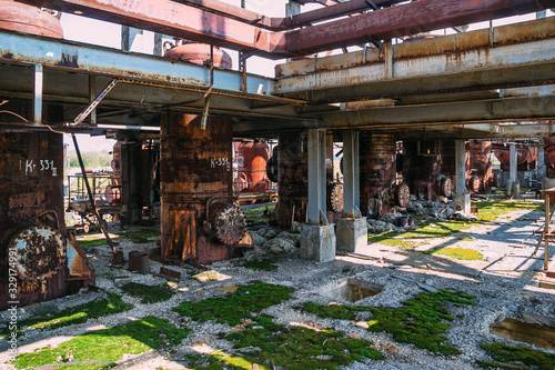 Abandoned ruined chemical plant with remain rusty tanks and pipes © Mulderphoto