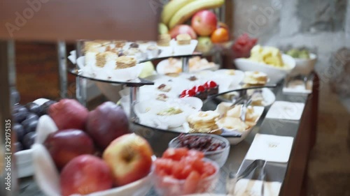 The camera flies over the buffet table