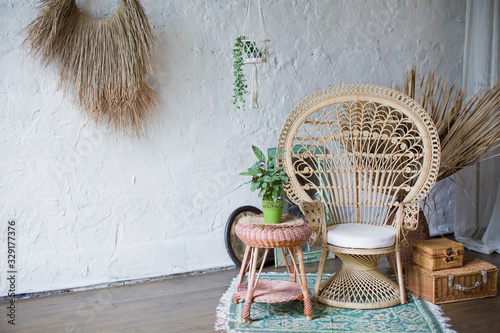 Rattan peacock chair in loft room with boho decorations Stock Photo | Adobe  Stock