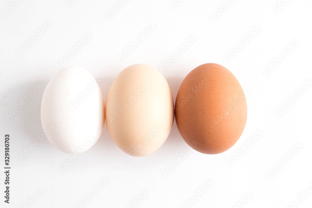 Three eggs on white background. Top view Three eggs on white background. Top view